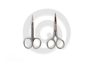 2 types of small steel nail scissors on white background
