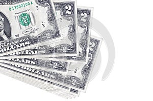 2 US dollars bills lies in small bunch or pack isolated on white. Mockup with copy space. Business and currency exchange