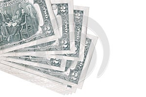 2 US dollars bills lies in small bunch or pack isolated on white. Mockup with copy space. Business and currency exchange