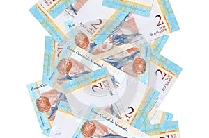 2 Venezuelian bolivar bills flying down isolated on white. Many banknotes falling with white copyspace on left and right side
