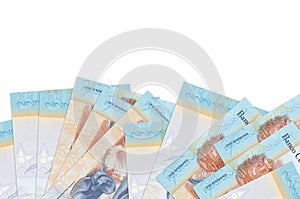 2 Venezuelian bolivar bills lies on bottom side of screen isolated on white background with copy space. Background banner template