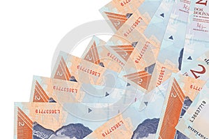 2 Venezuelian bolivar bills lies in different order isolated on white. Local banking or money making concept