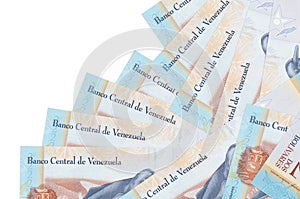 2 Venezuelian bolivar bills lies in different order isolated on white. Local banking or money making concept