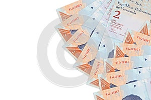 2 Venezuelian bolivar bills lies isolated on white background with copy space. Rich life conceptual background