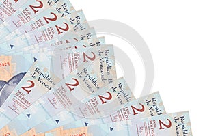 2 Venezuelian bolivar bills lies isolated on white background with copy space stacked in fan close up