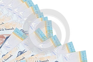 2 Venezuelian bolivar bills lies isolated on white background with copy space stacked in fan close up