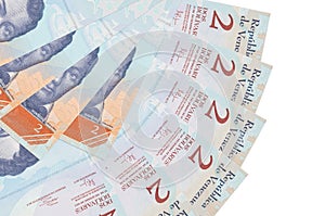 2 Venezuelian bolivar bills lies isolated on white background with copy space stacked in fan shape close up