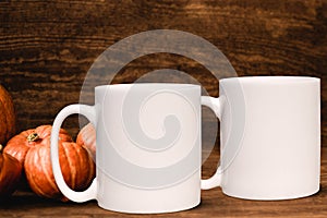 2 white blank coffee mugs Autumnal theme mock up.