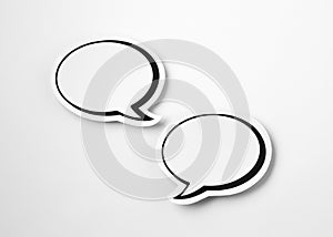 2 white paper speech bubbles