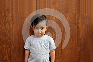 2-year-old young brown-haired Latino boy with Asperger`s Syndrome which is part of Autism Spectrum Disorder ASD