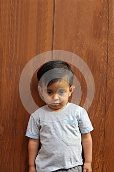 2-year-old young brown-haired Latino boy with Asperger`s Syndrome which is part of Autism Spectrum Disorder ASD