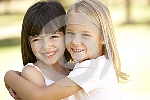 2 Young Girls Giving Each Other Hug