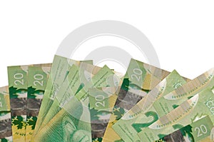 20 Canadian dollars bills lies on bottom side of screen isolated on white background with copy space. Background banner template