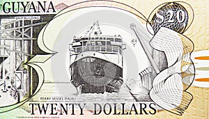20 Dollars banknote, Bank of Guyana, closeup bill fragment shows Ferry vessel Malali