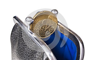 20 euro coin in open purse isolated on a white background