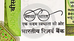 20 Rupees banknote. Bank of India. Fragment: Gandhi`s spectacles eyeglasses as Swachh Bharat Abhiyan Clean India Mission logo