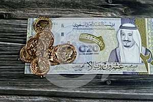 20 SAR twenty Saudi Arabia Riyals banknote currency bill money Commemorative issue with sovereign British gold coins shapes