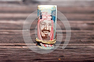 20 SAR twenty Saudi riyals cash money banknote bills rolled up with rubber bands with the photo of king AbdulAziz and Quba mosque