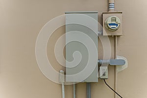 A 200-Amp automatic transfer switch mounted on the wall of a house