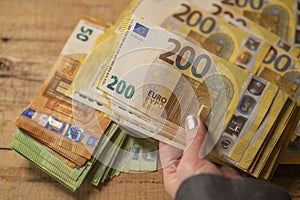 200 euro banknotes. Recalculation of money. Hands recalculate banknotes.Expenses and incomes in European countries.pack