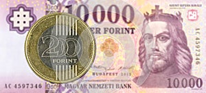 200 hungarian forint coin against 10000 hungarian forint