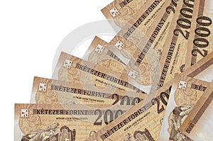 2000 Hungarian forint bills lies in different order isolated on white. Local banking or money making concept