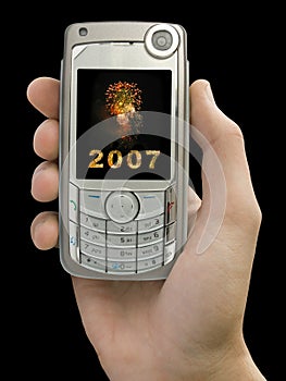 2007a ohňostroj na zobrazit z mobilní telefon v ruce 