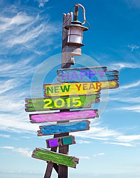 2015 happy new year on wooden direction signs