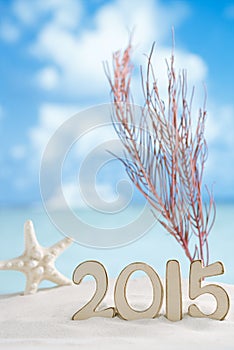 2015 letters with starfish, ocean ,white sand beach