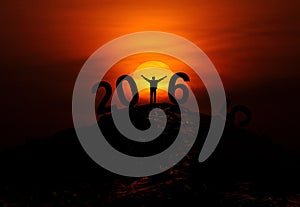 2016 new year text - silhouette of man on hill top