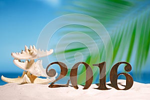 2016 numbers letters with starfish, ocean , beach and seascape