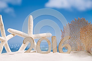 2016 numbers letters with starfish, ocean , beach and seascape
