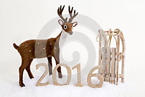 2016 text background winter deer and sledge