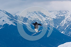 2017 04 Sochi, Russia, Festival NewStarCamp: snowboarder jumps from a high springboard