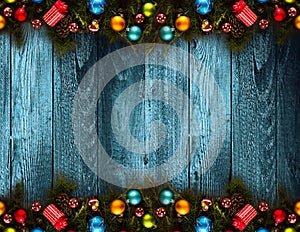 2017 Happy New Year seasonal background with real wood green pine, colorful Christmas baubles, gift boxe and other seasonal stuff