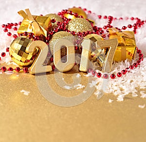 2017 year golden figures on the background of Christmas decorations