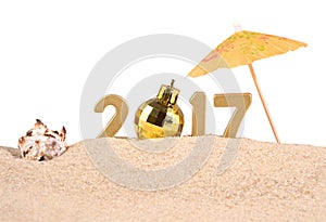 2017 year golden figures with seashell on a white