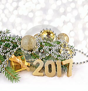 2017 year golden figures and spruce branch and Christmas decorations