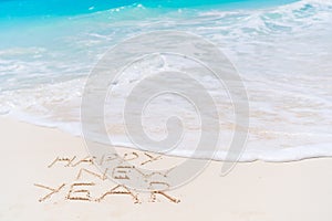 2018 inscription written on sandy beach, New Year greeting card.