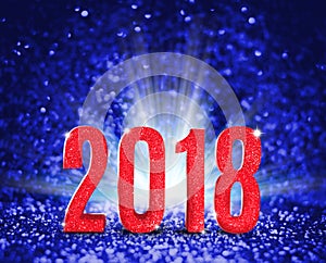 2018 new year with red glitter texture with white explore light