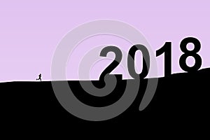 2018 New Year. Two thousand eighteen. Silhouette of the athlete running from foothills to the top of the mountain