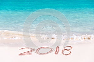 2018 written on the sand of a beach, travel 2018 new year