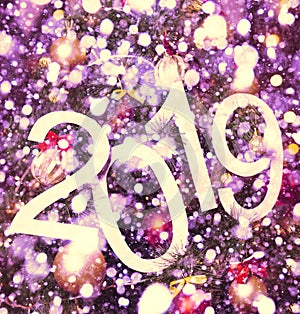 2019 abstract text on purple background of christmas tree and lights - bright holiday backdrop