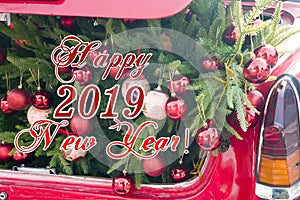 2019 Christmas and new year concepts,An opened red car trunk filled with cloth bags full of gifts and decorations for