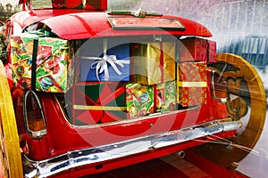 2019 Christmas and new year concepts,An opened red car trunk filled with cloth bags full of gifts and decorations for