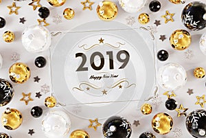 2019 greetings card with golden baubles 3D rendering