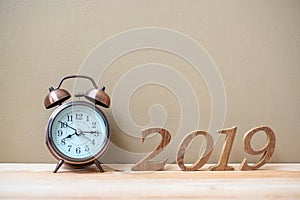 2019 Happy New years with retro alarm clock and wooden number on table and copy space. New Start, Resolution, Goals and Mission