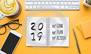 2019 new year goal,plan,action text on notepad