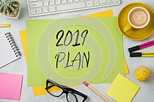 2019 plan text on colorful paper memo note with business office