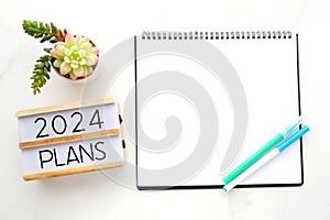 2019 on wood box, blank notebook paper on white marble table background, 2019 new year mock up, template with copy space for text